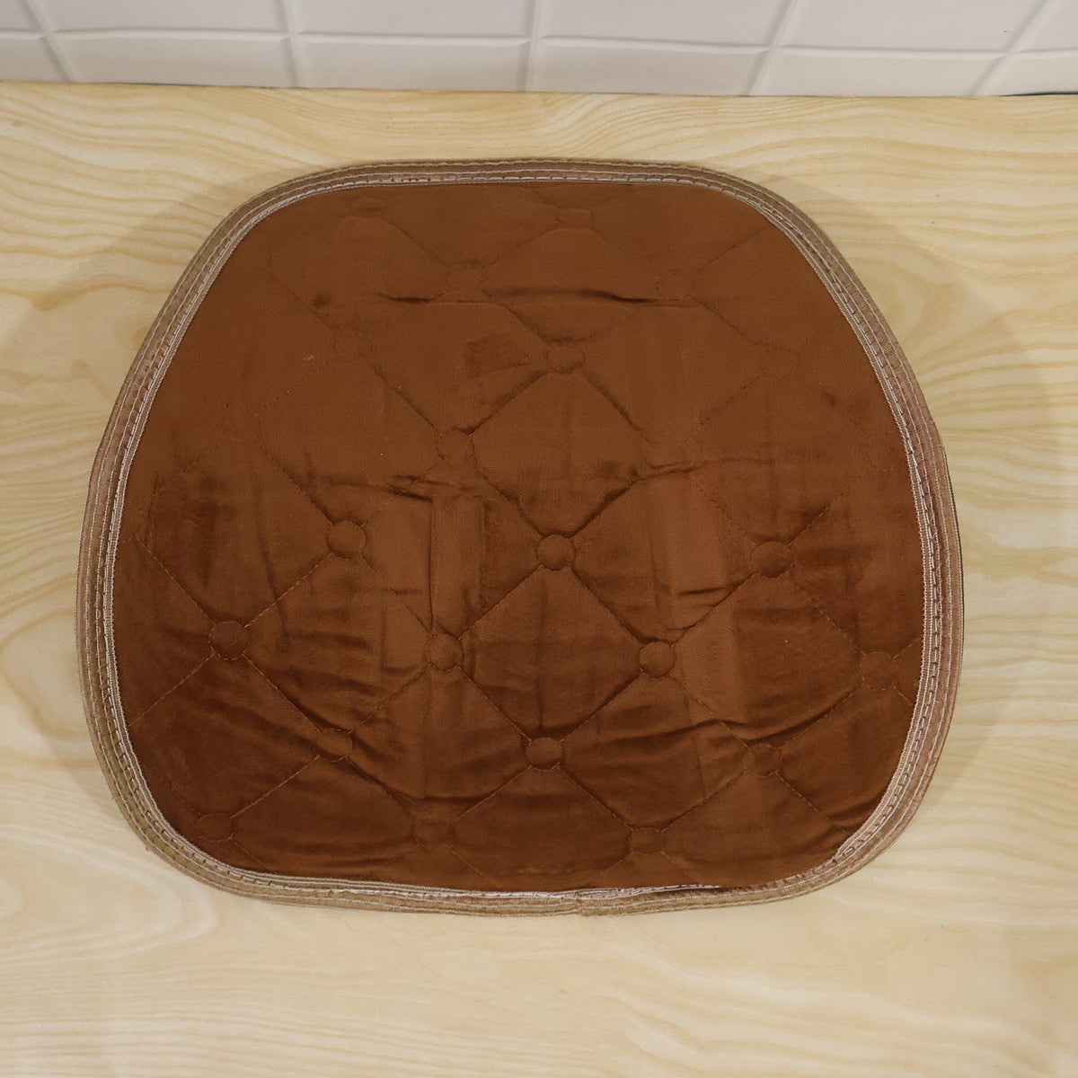 Brown quilted velvet lumbar support cushion from different angle