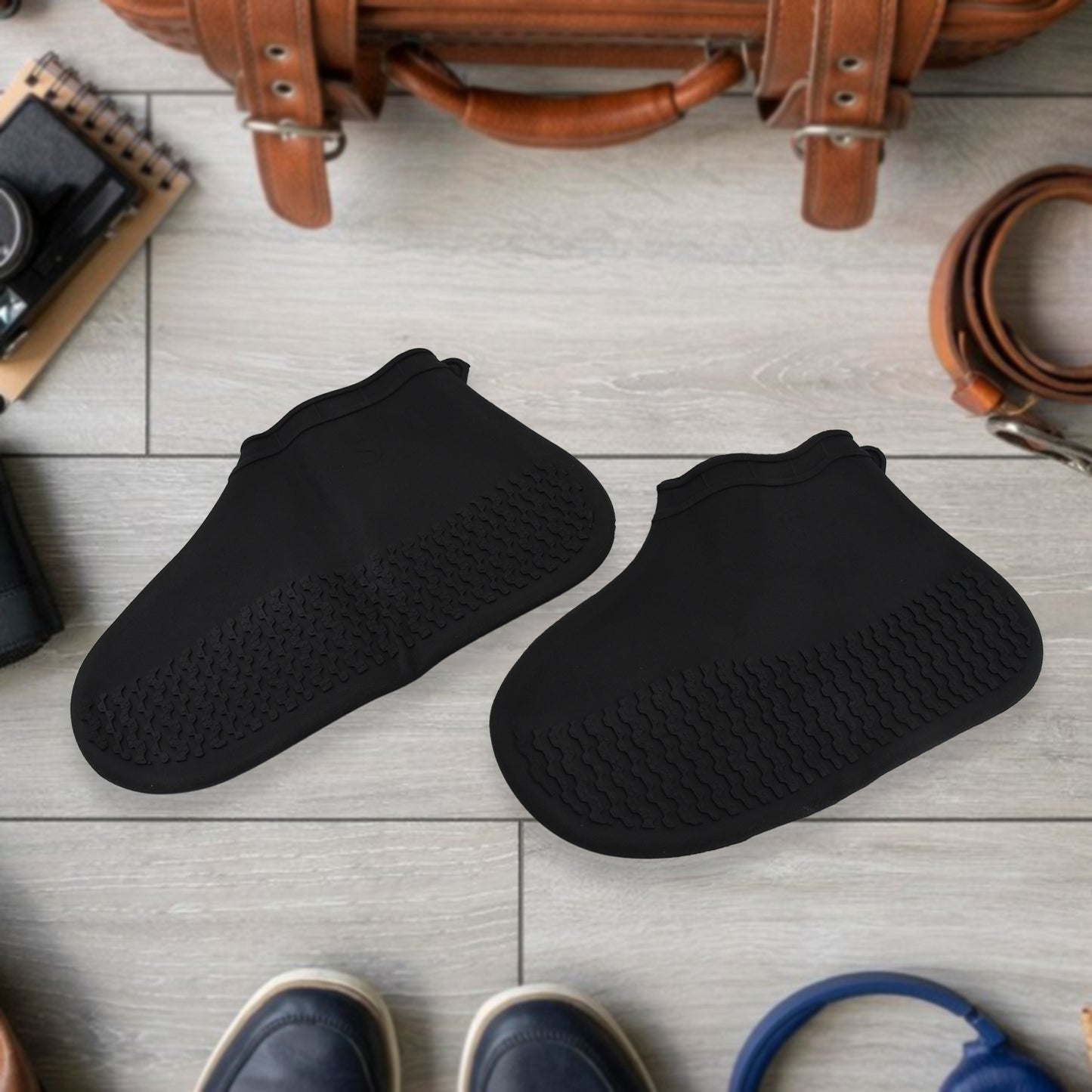 Shoe covers stretched over shoes showing flexible silicone material