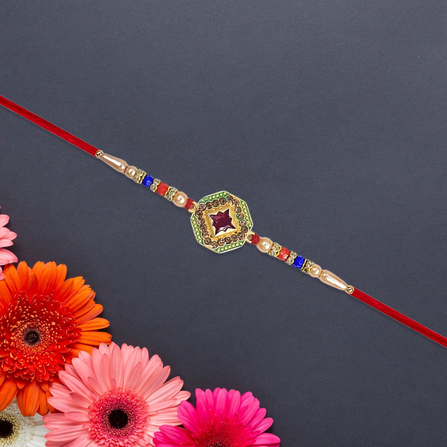 Designer Stone Rakhi with Red Centerpiece, Pearl Beads & Colorful Detailing – Elegant Thread for Raksha Bandhan