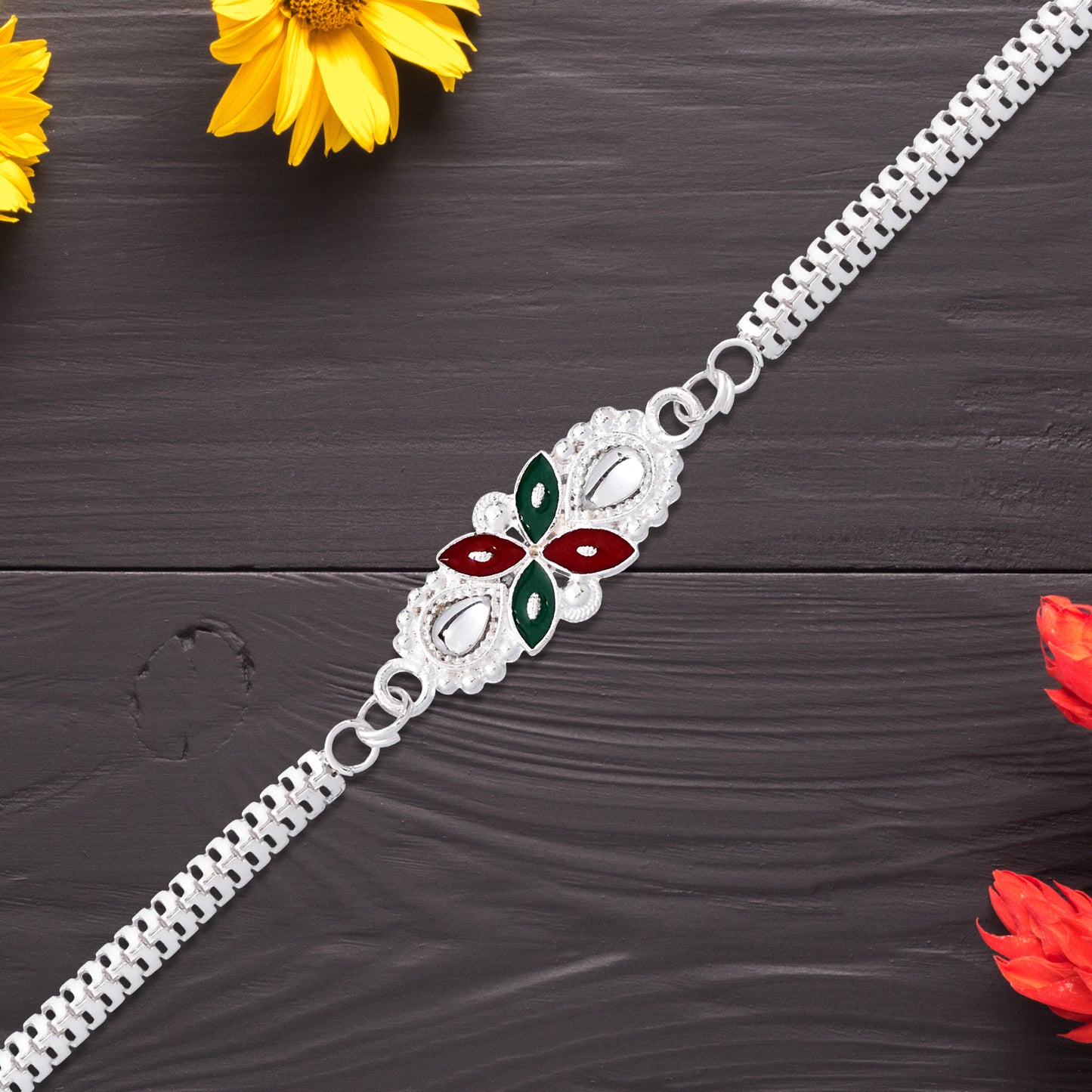 Detailed view of Elegant Floral Rakhi with red-green enamel