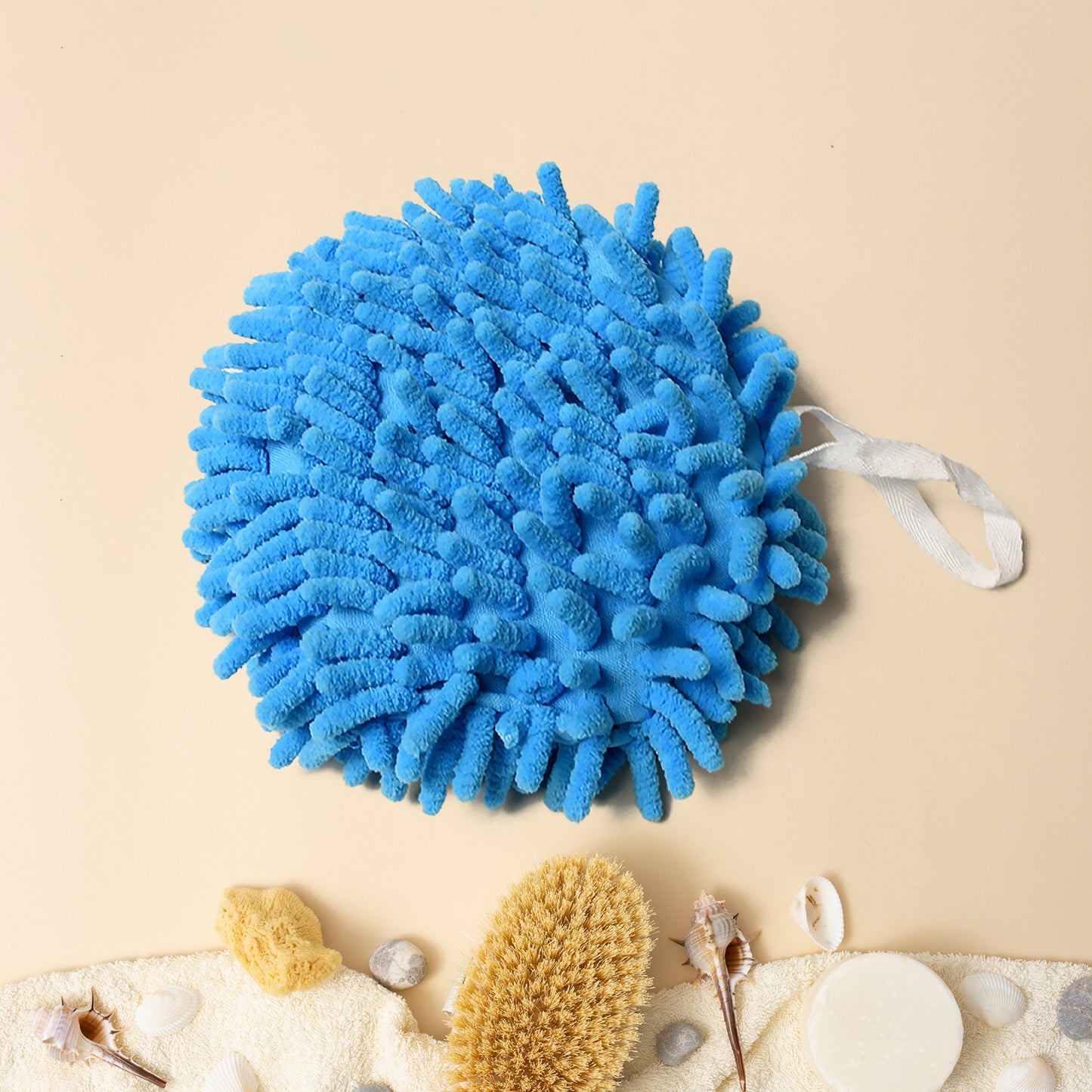 Hand towel hanging by loop on kitchen faucet