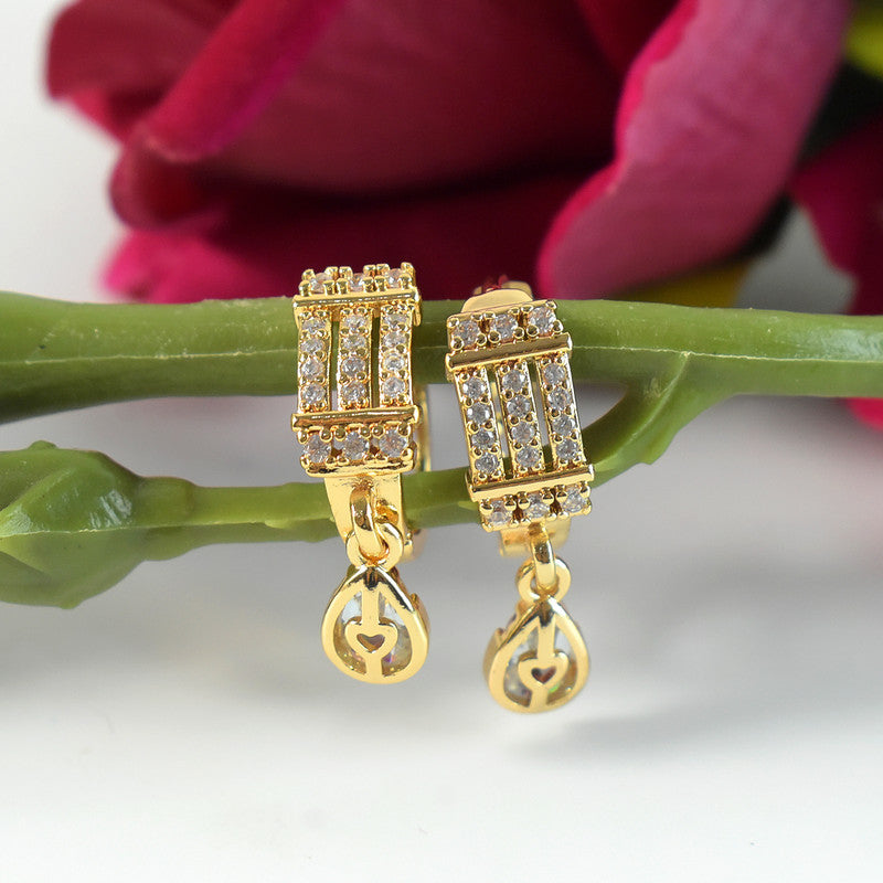 Close-up of sparkling rectangular cubic zirconia stones on stylish drop earrings