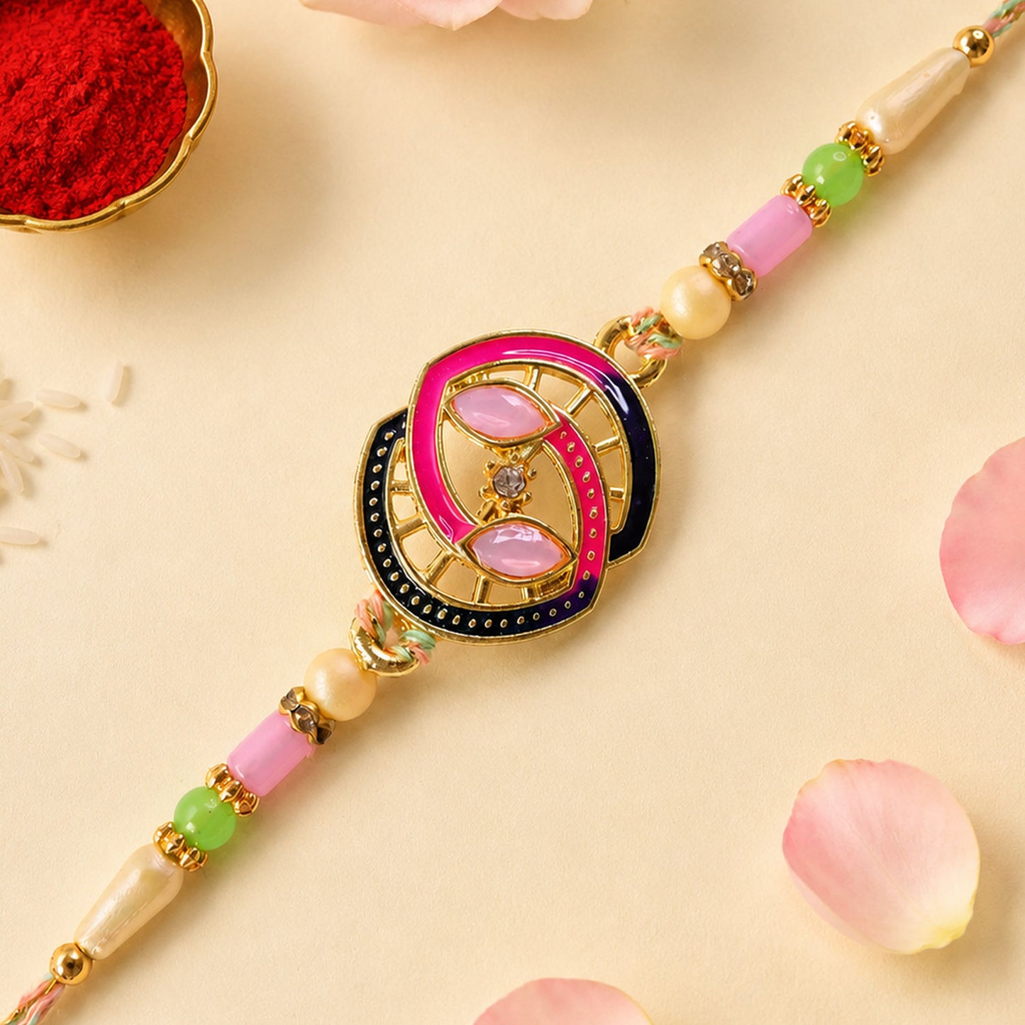 Black and Pink Enamel Spiral Pendant Rakhi with Pastel Beads