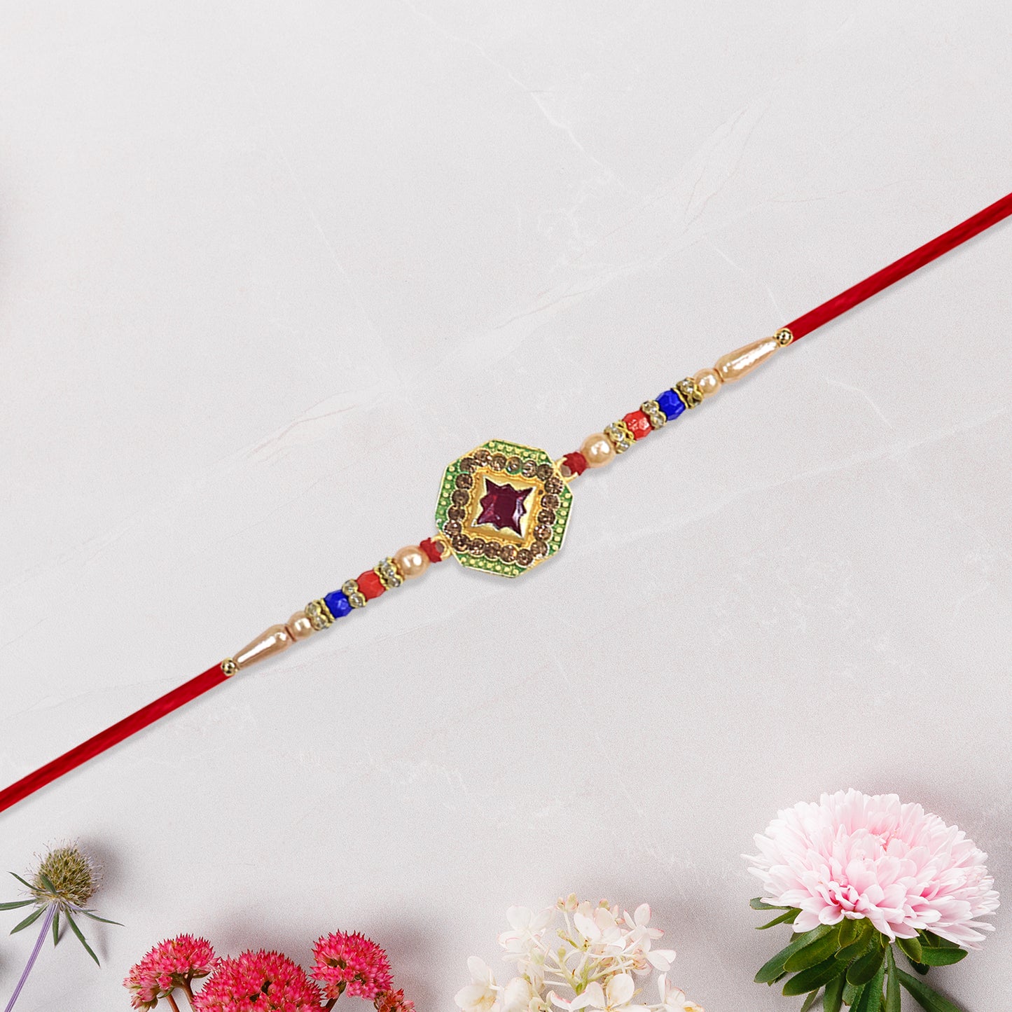 Designer Stone Rakhi with Red Centerpiece, Pearl Beads & Colorful Detailing – Elegant Thread for Raksha Bandhan