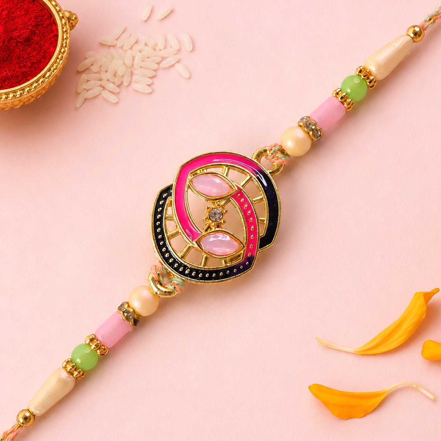 Black and Pink Enamel Spiral Pendant Rakhi with Pastel Beads