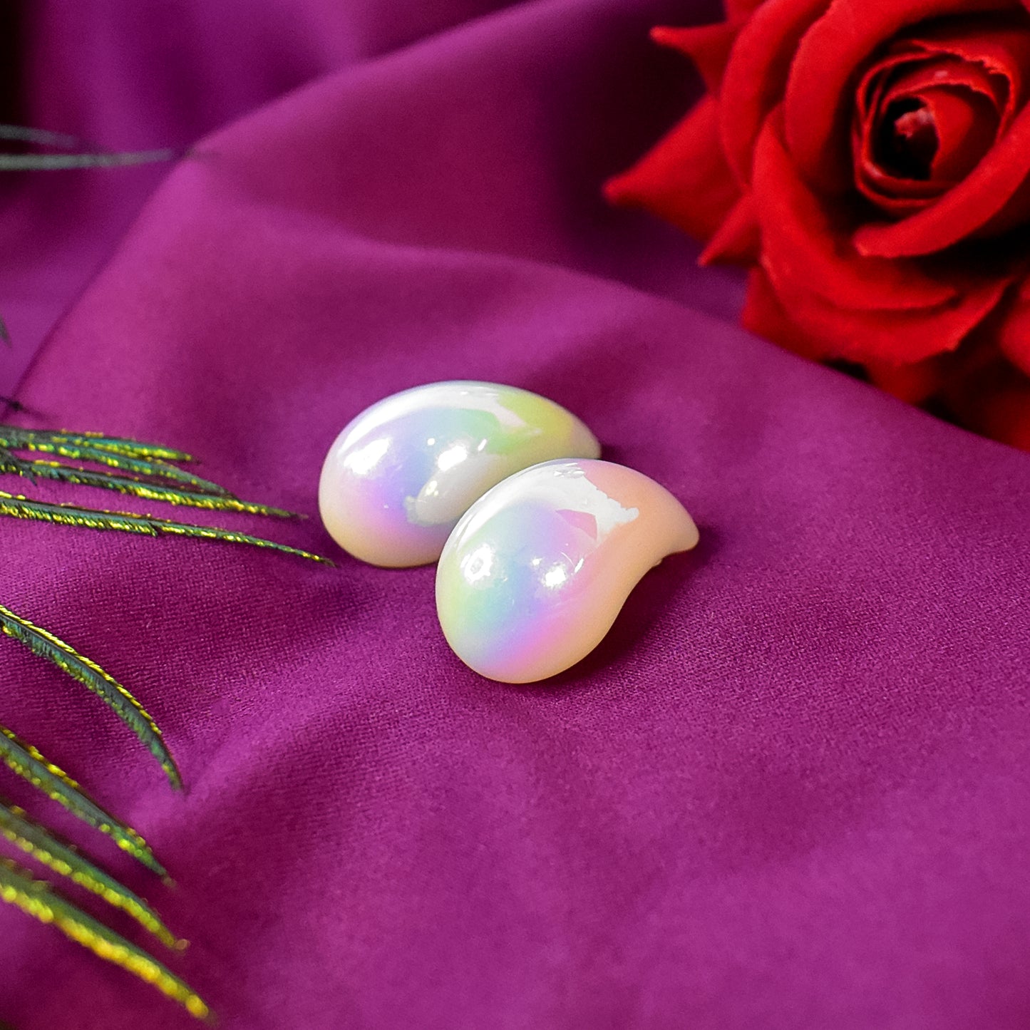 Elegant Kaju Design Earrings from HV, showcasing a unique cashew shape on a clean white background.