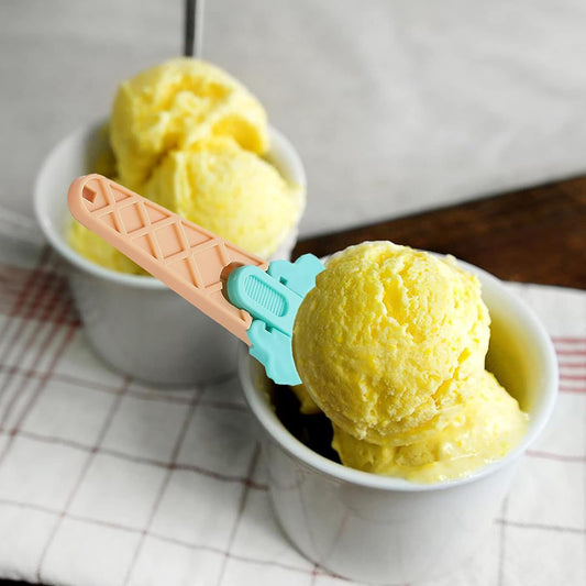 Ice cream serving spoon with ergonomic handle