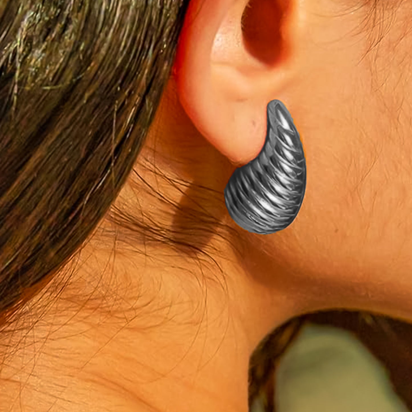 Model wearing stylish Kaju earrings, showcasing their comfortable fit and statement appeal.