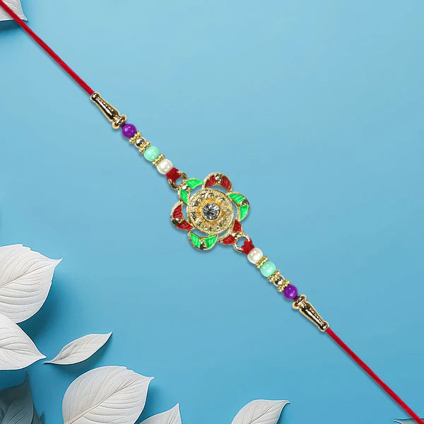 Gold Plated Floral Rakhi displayed beautifully for festive gifting.