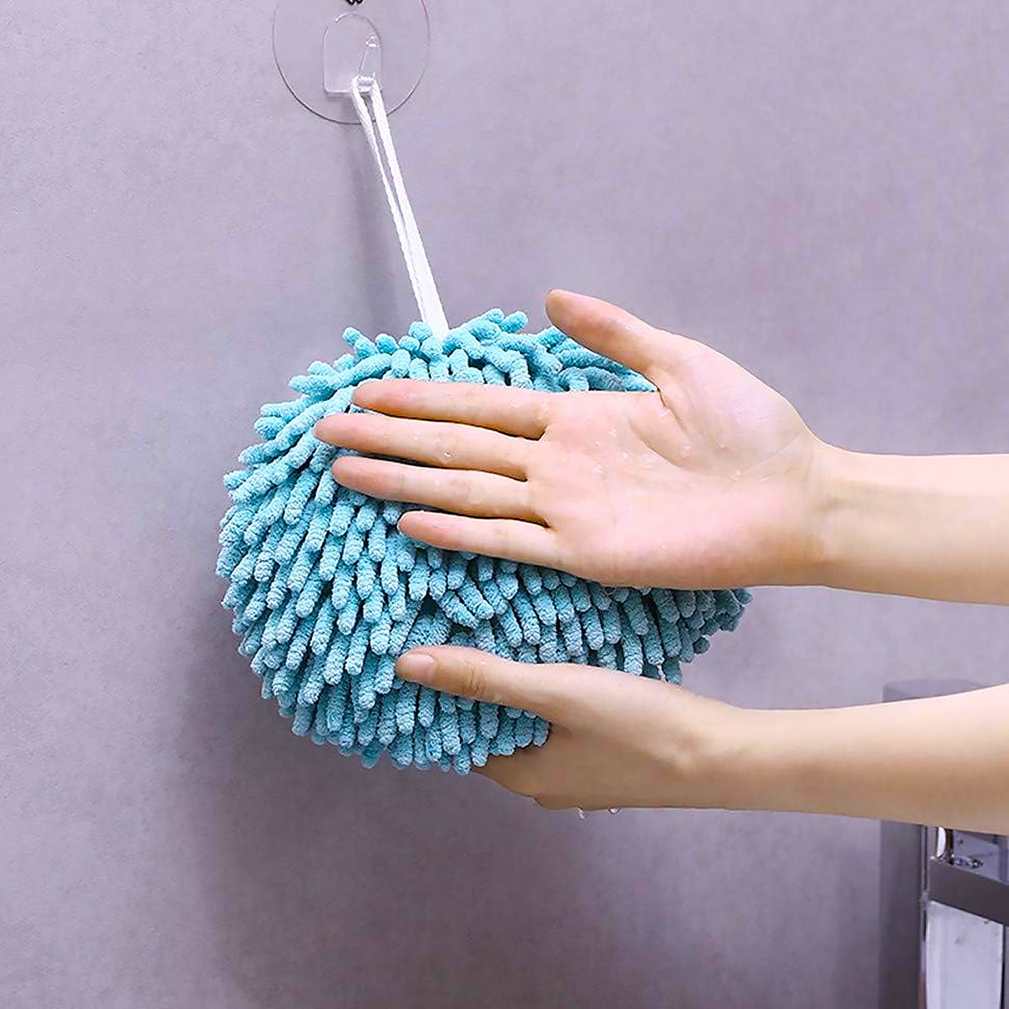 Hand towel draped on bathroom sink with loop