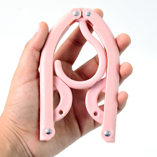 Portable folding travel hanger in compact form