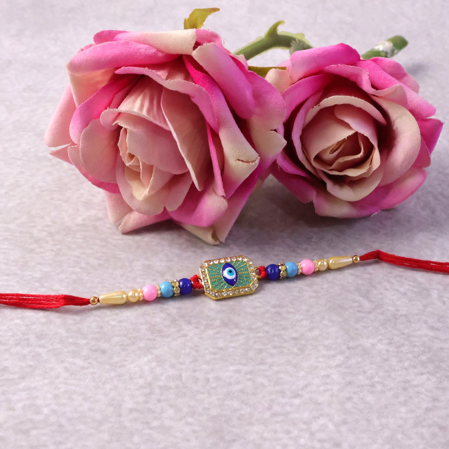 Side view of Evil Eye Rakhi with stylish centerpiece
