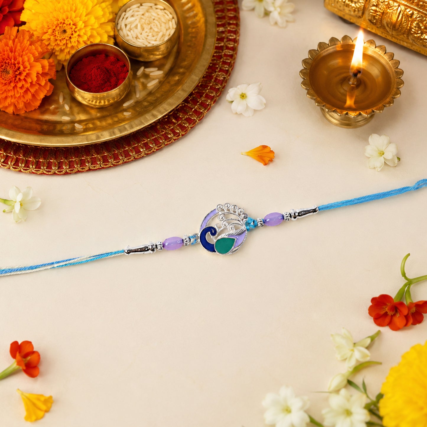 Hand holding Designer Peacock Motif Rakhi