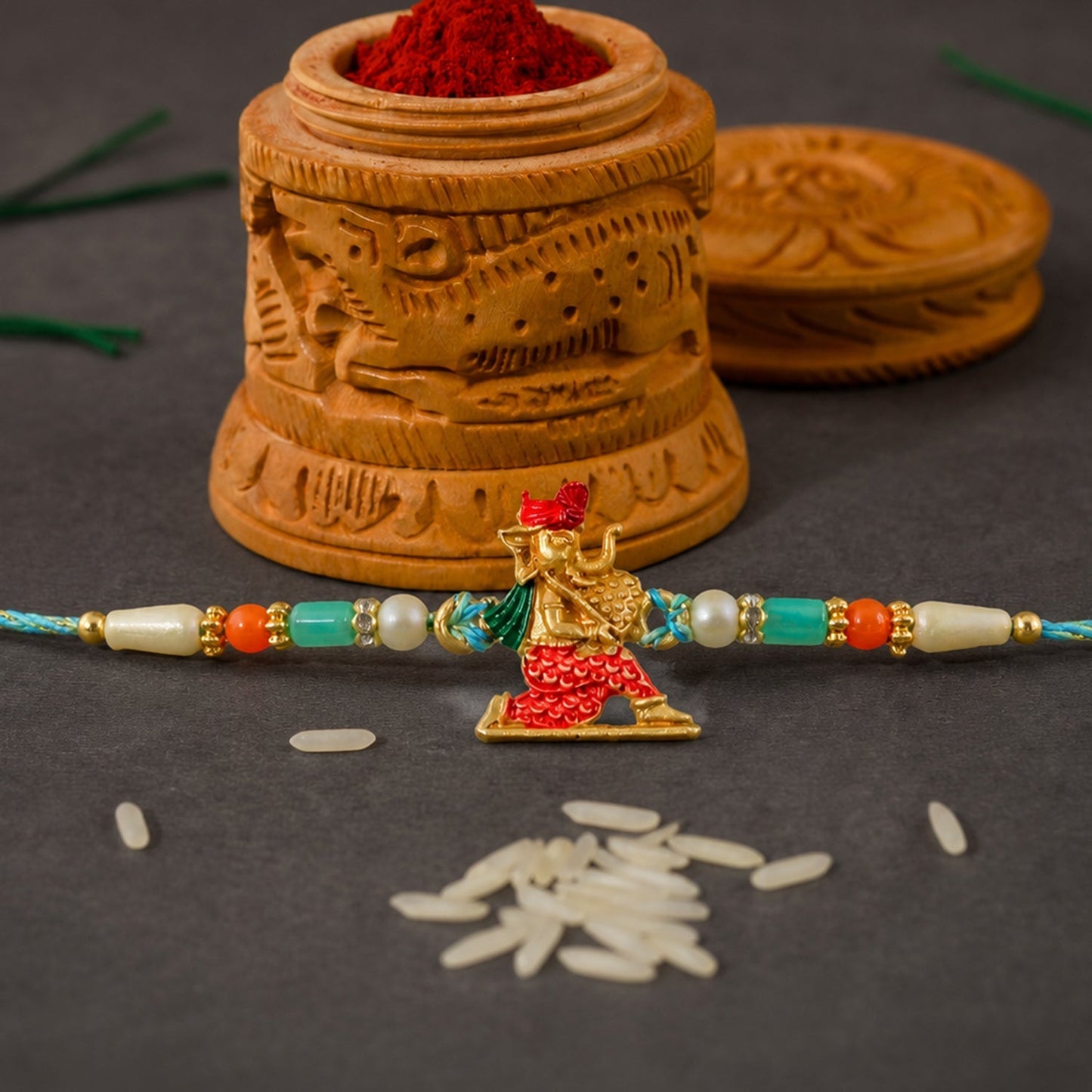 Ganesh Charms Rakhi with Turquoise and Pearl Beads Elegant Festival Accessory (10pcs)