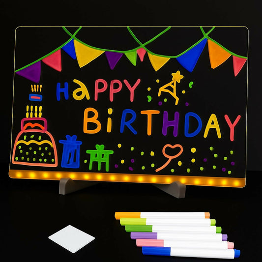 Close-up of neon markers glowing on LED writing board