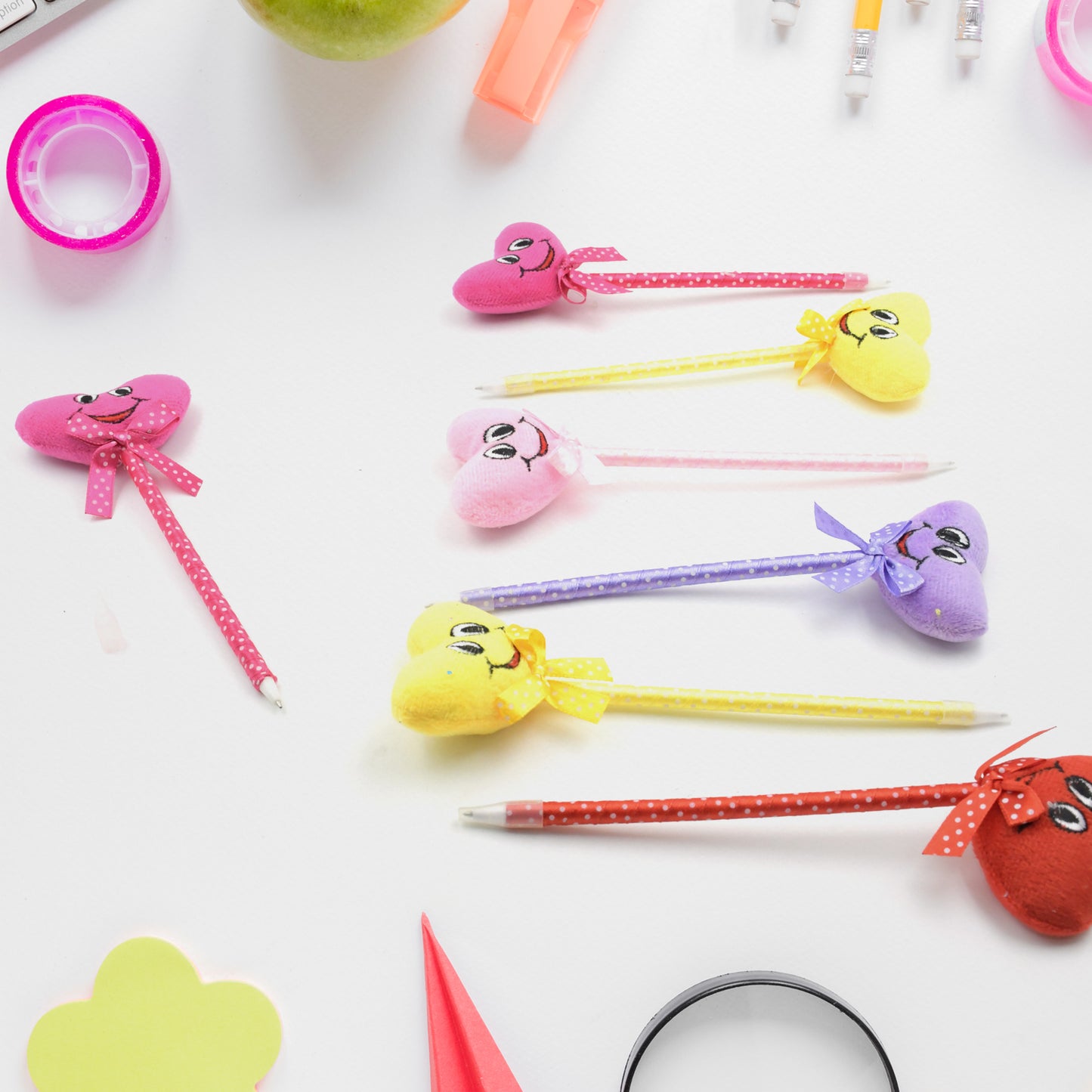A mix of colorful cartoon and heart design pens