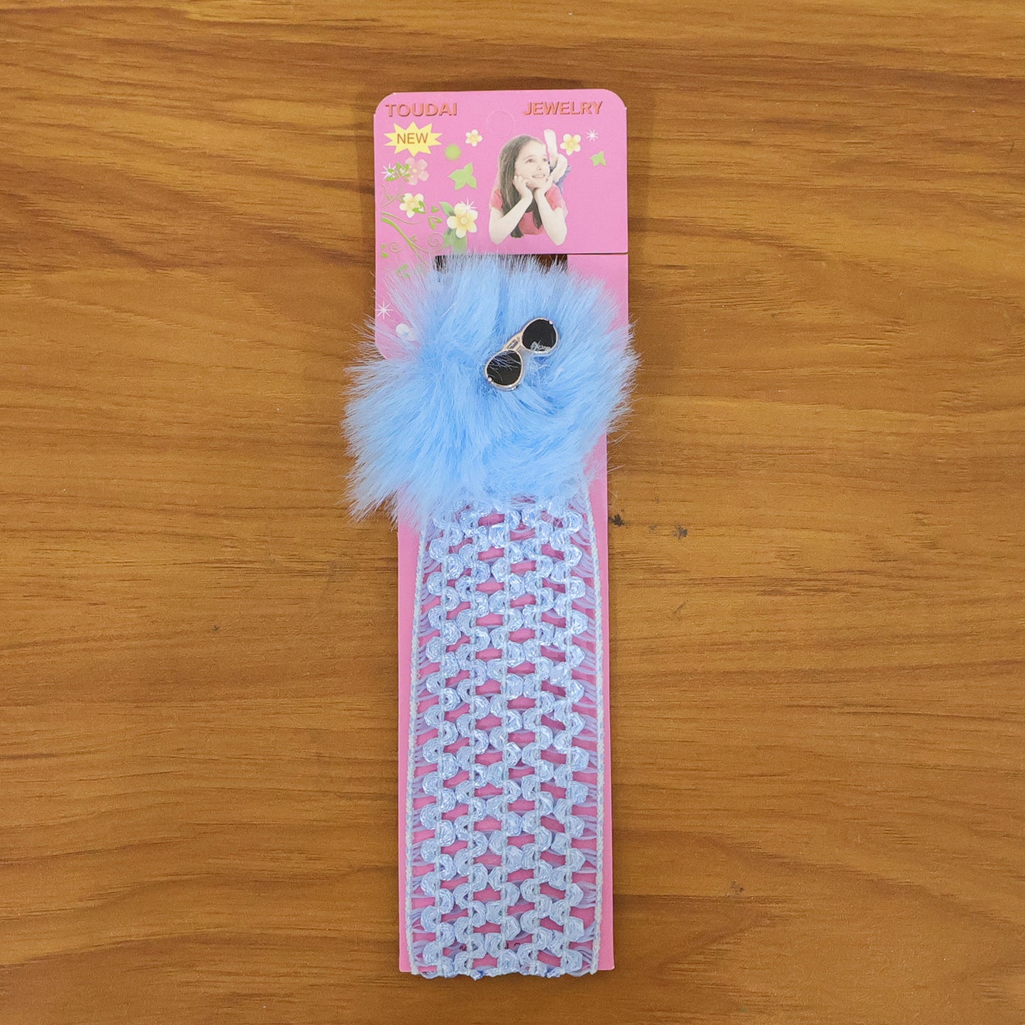 Stylish baby girl headband with pom pom design