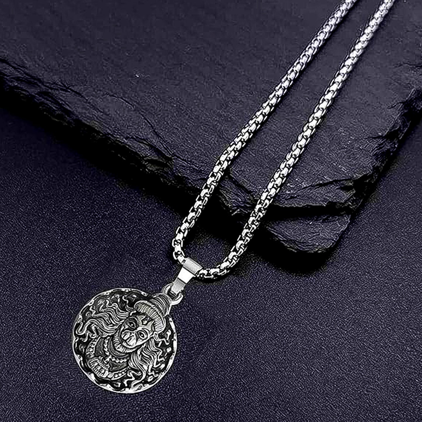 Detailed view of the Hanuman Locket with its accompanying chain.