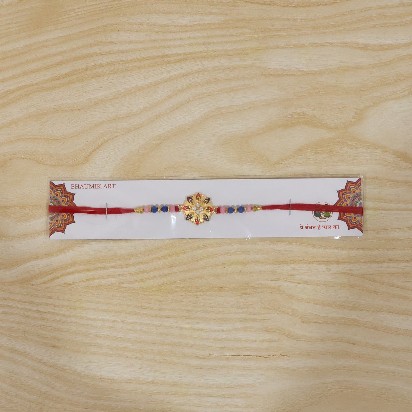 Decorative floral rakhi with intricate beadwork