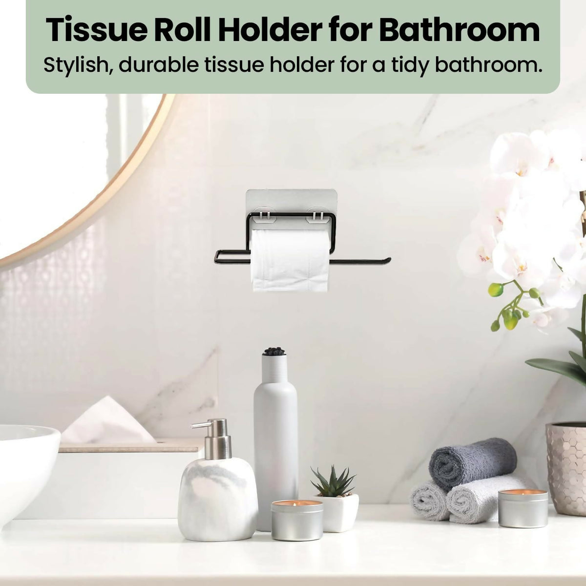 Black metal paper towel holder mounted on a white marble wall, holding a roll of toilet paper.