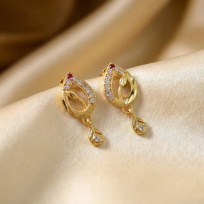 Gold teardrop earrings displayed on white background