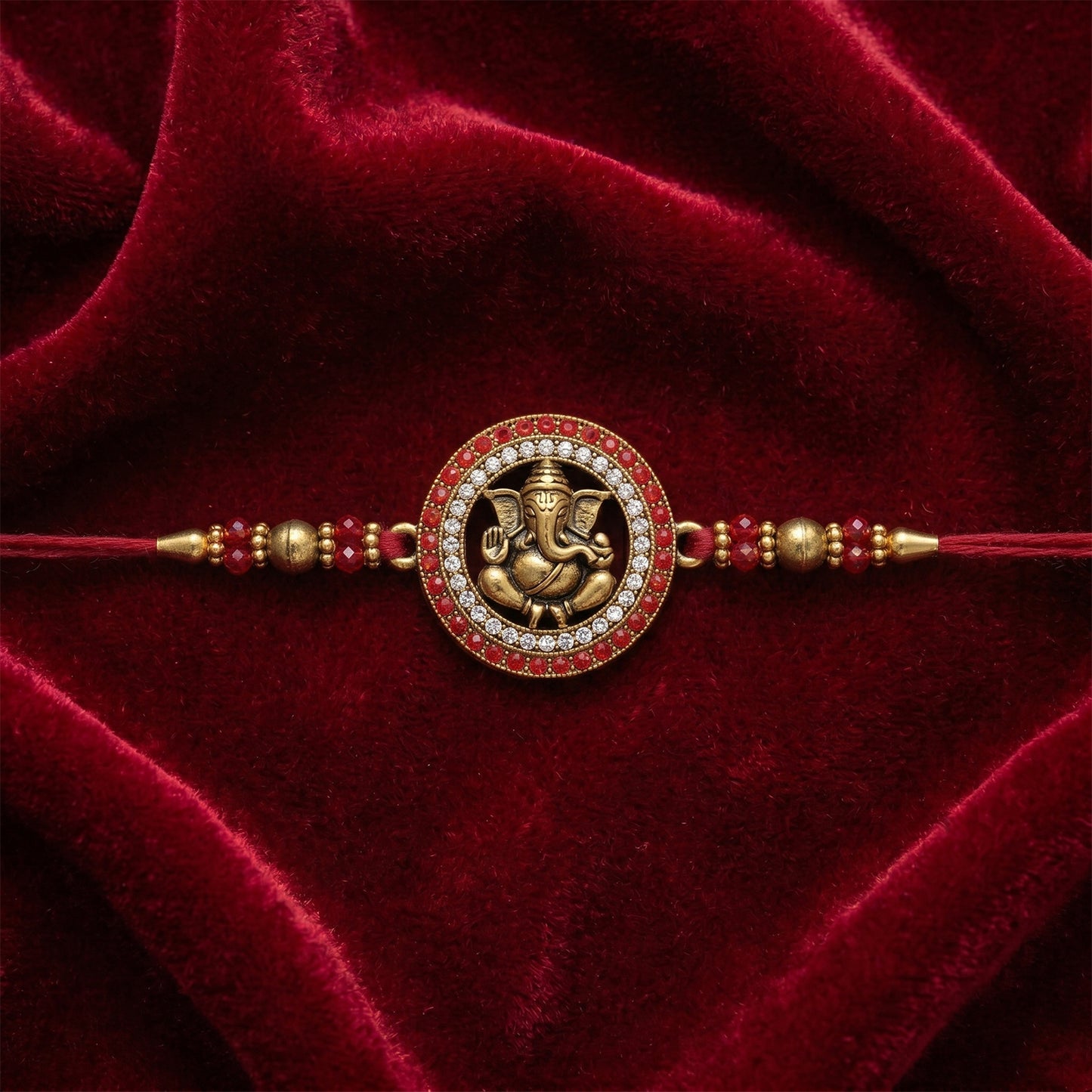 Golden Ganesh Rakhi for Boys with Red Thread and Rudraksha Beads