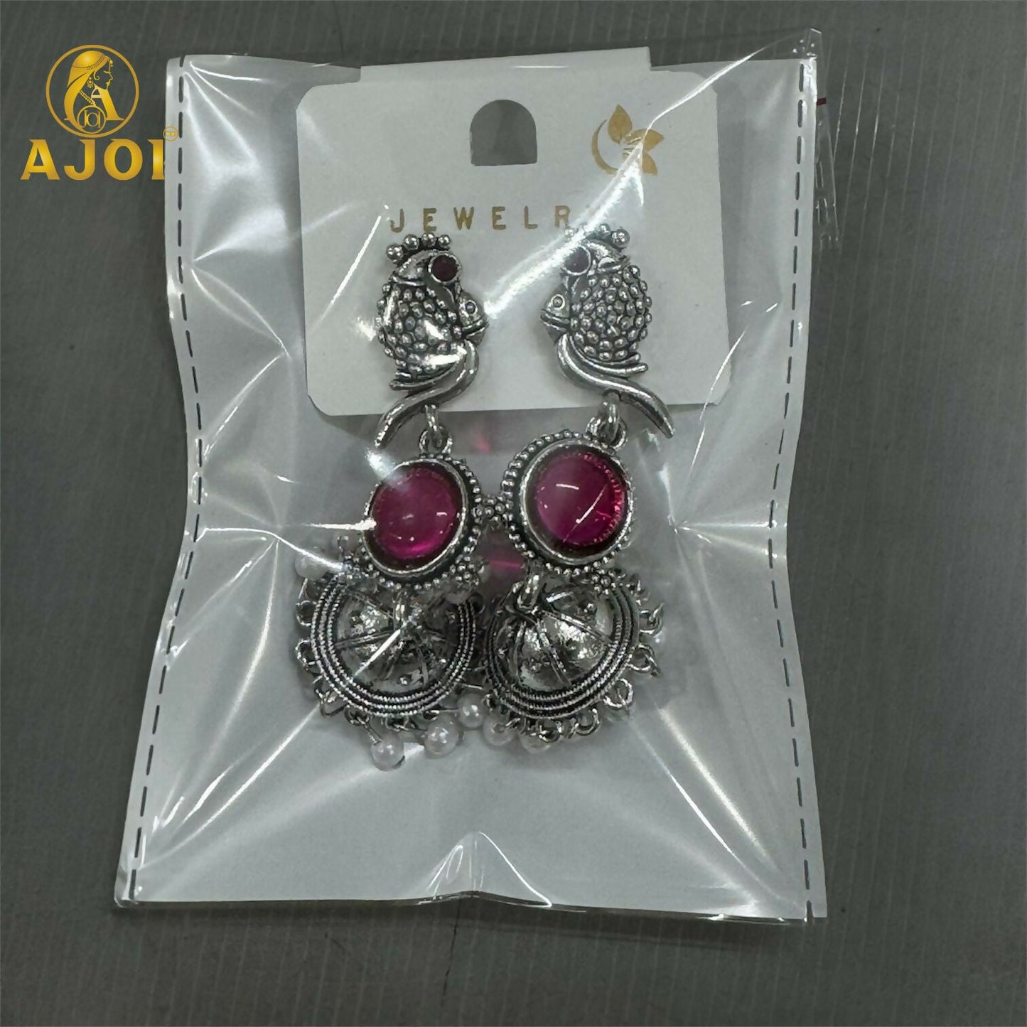 Antique silver peacock jhumka earrings styled with ethnic outfit