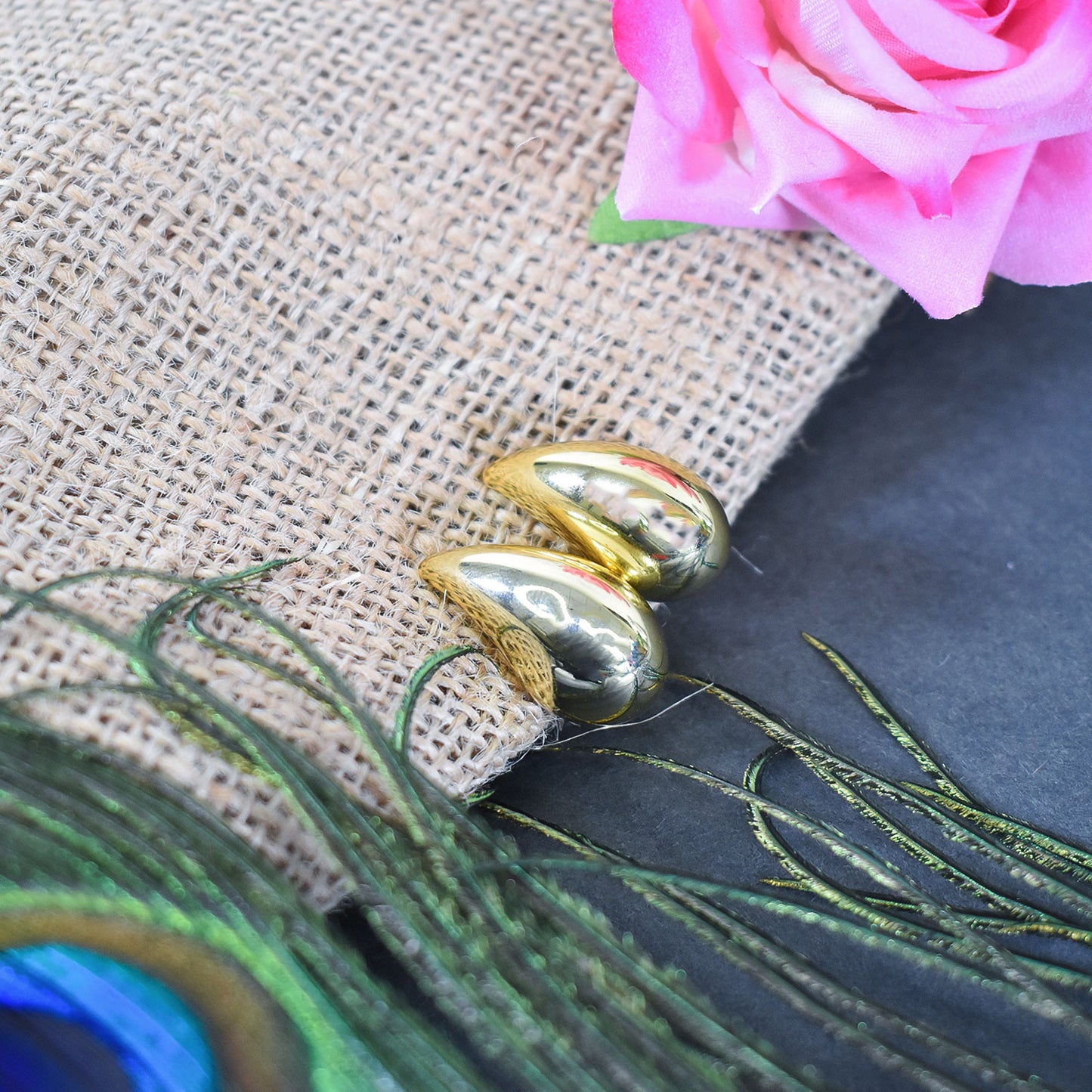 Elegant Kaju Design Earrings displayed alongside other Indian jewelry pieces.