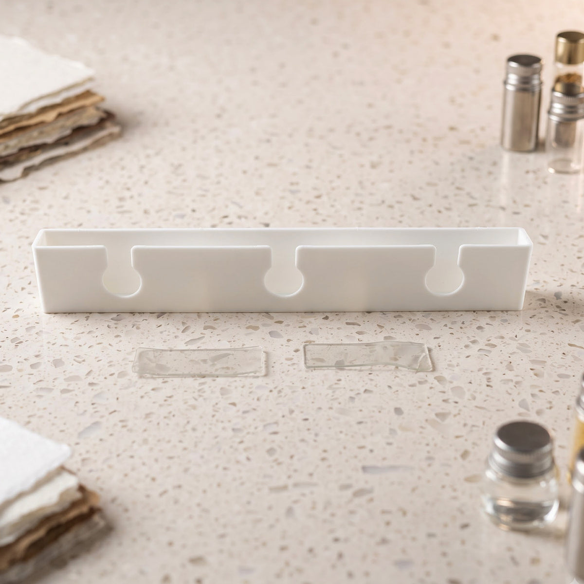 Wine glass hanger with adhesive mounting strips