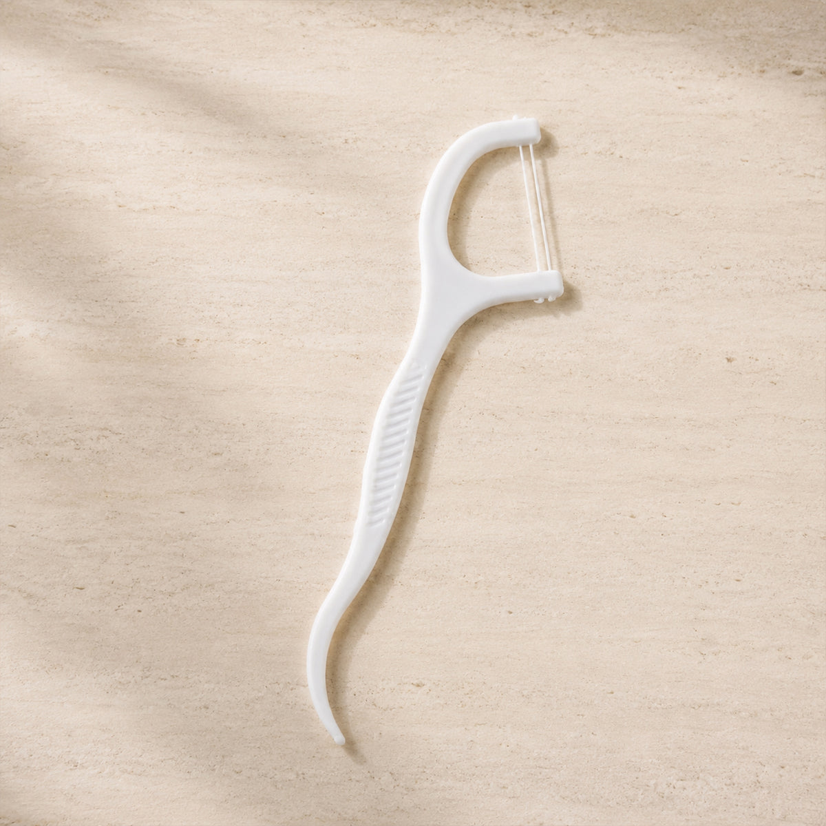 2 in 1 floss toothpick stick on clean background