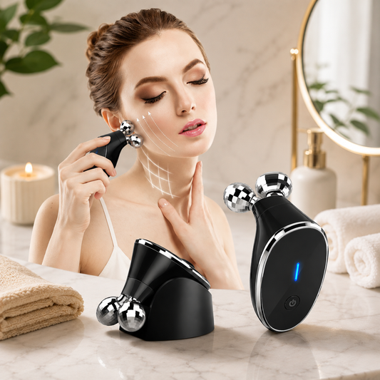 A woman uses a black and silver microcurrent face massager on her cheek, with two more devices on a marble counter.