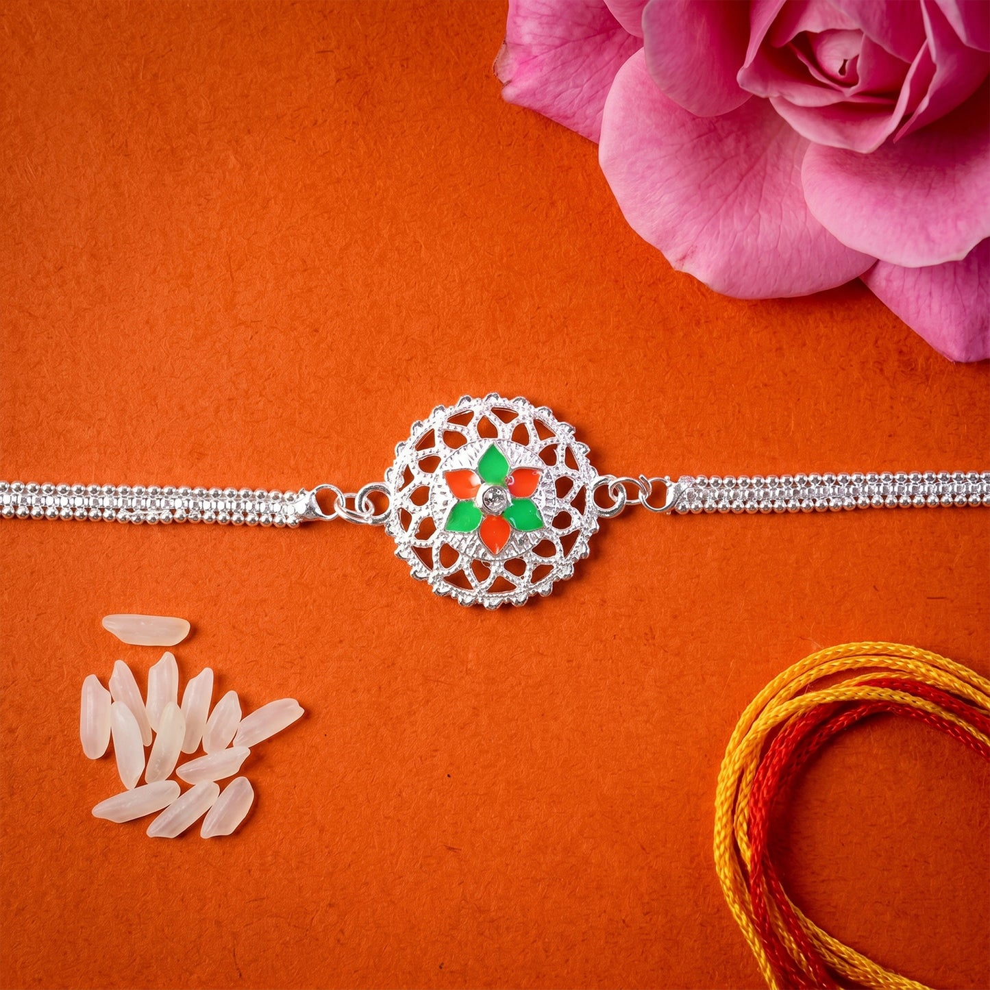 Silver floral designer Rakhi bracelet with decorative beads