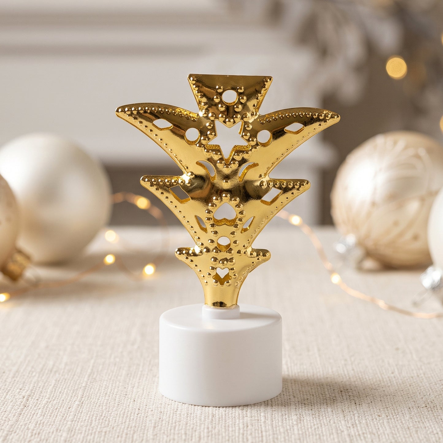 Golden Christmas tree LED tealight candle close-up
