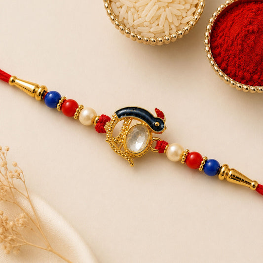 A red thread bracelet features a gold-toned centerpiece with a clear oval stone, flanked by red, blue, and pearl beads.