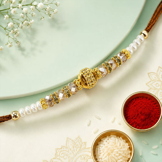 Pearl Golden Bracelet Rakhi with sleek beads and red thread