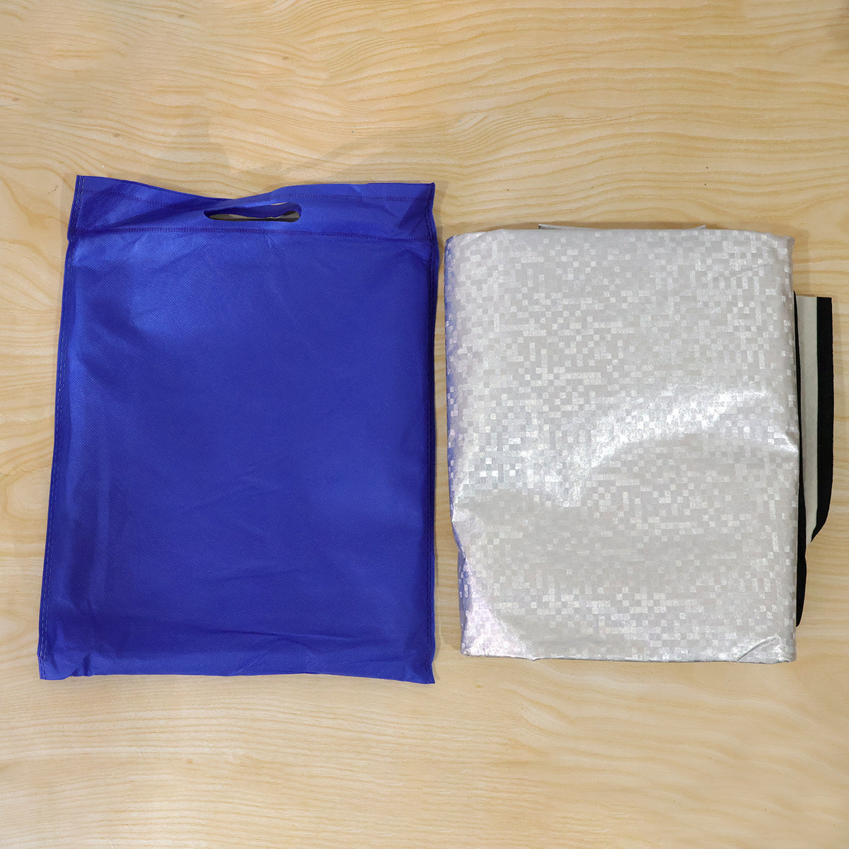 Actual folded windshield cover with cloth bag