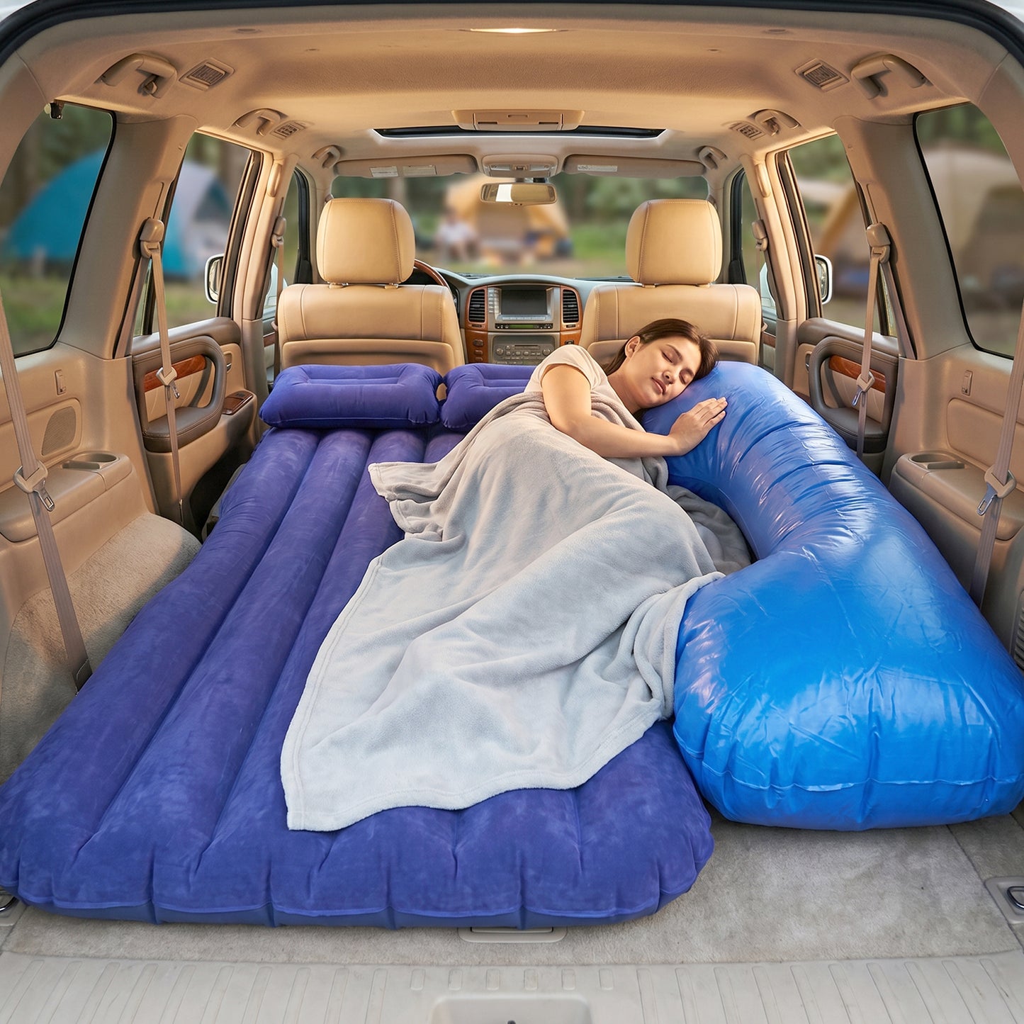 Couple relaxing on Car Air Mattress inside SUV