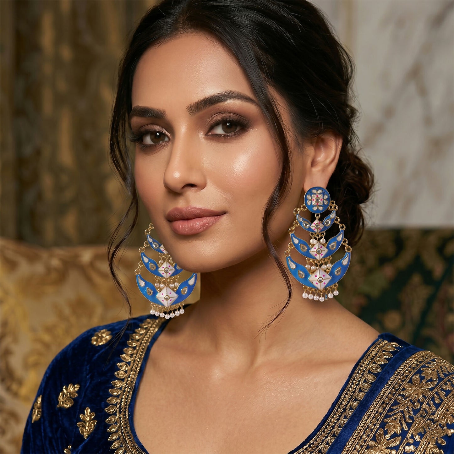 Side view of royal blue layered pearl ethnic earring