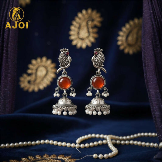 Antique Silver Peacock Jhumka Earrings with Red Stone Centerpiece & Pearl Drops