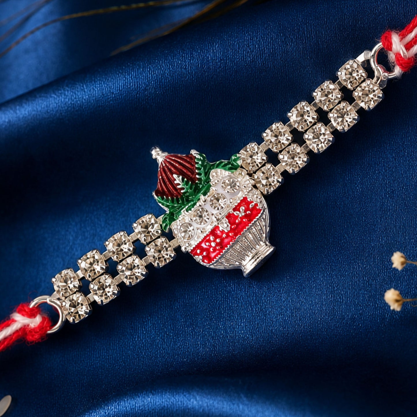 Festive Rakhi showcasing Kalash Charm, leaf detail and wrist style for Festive Use