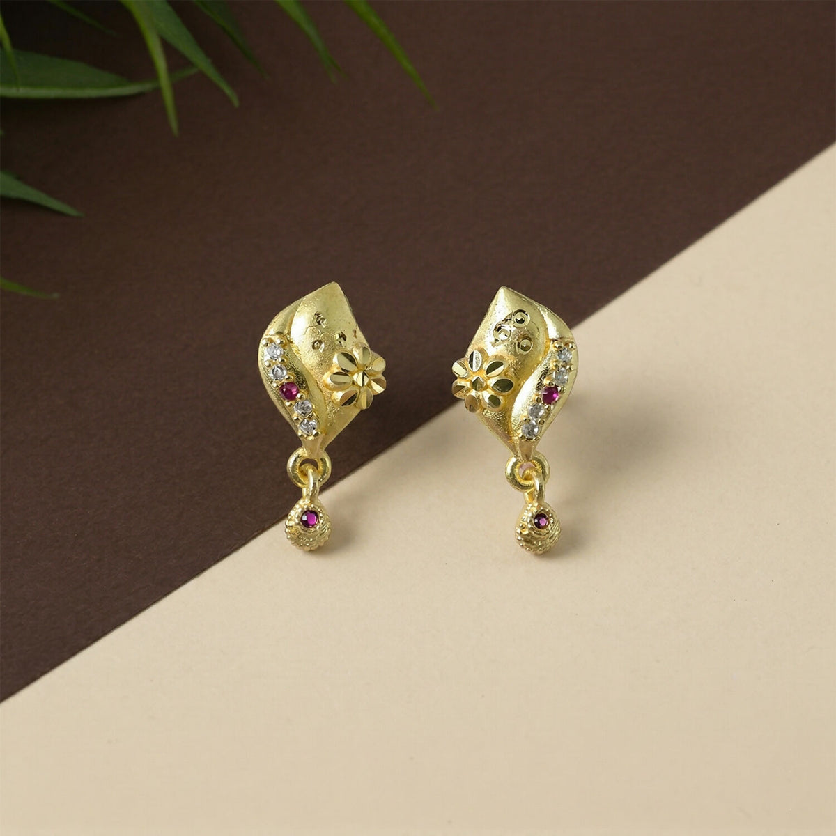 Elegant gold plated earrings with floral design and stone accents