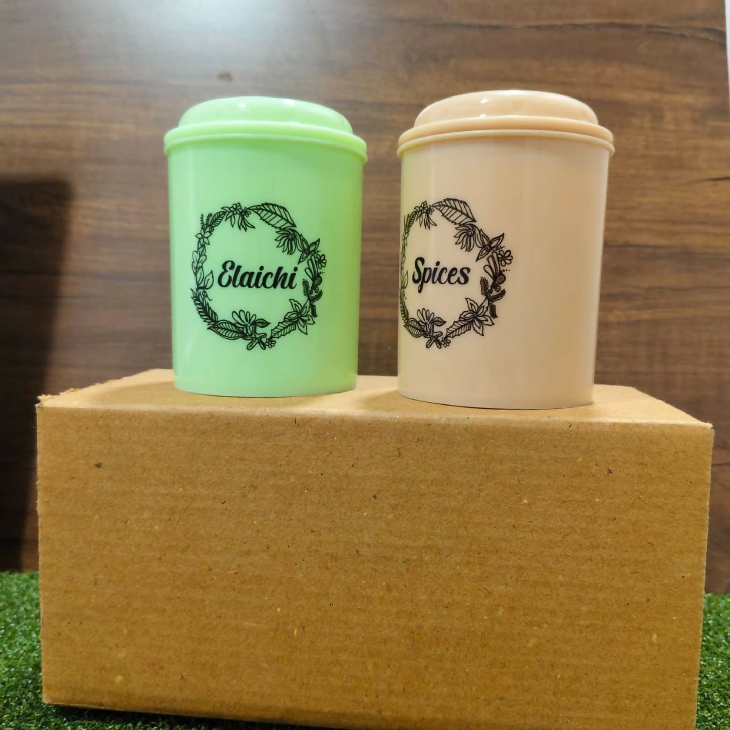 Three airtight spice storage jars in different pastel colors