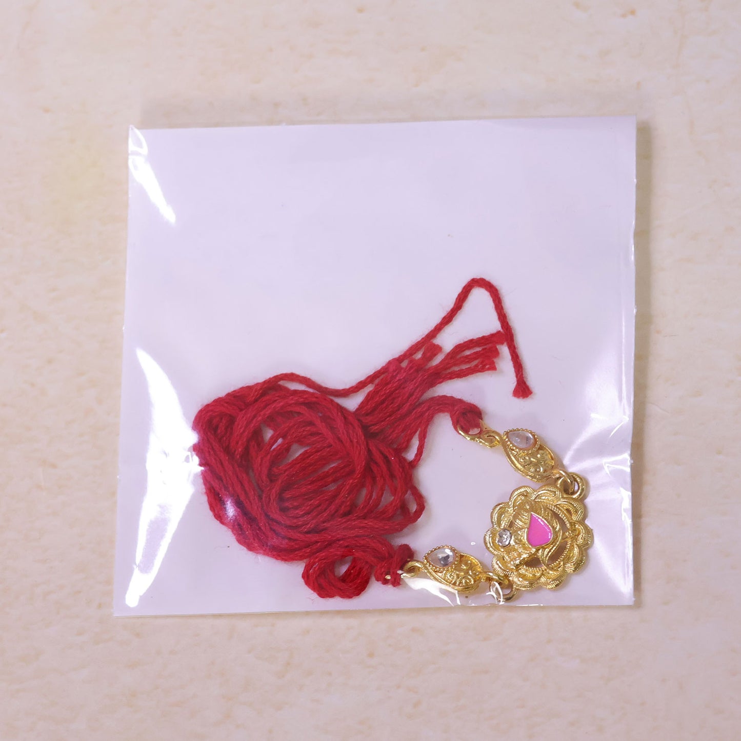 Premium Rakhi with Floral Medallion, crystal accents and gift style for Gift Styling