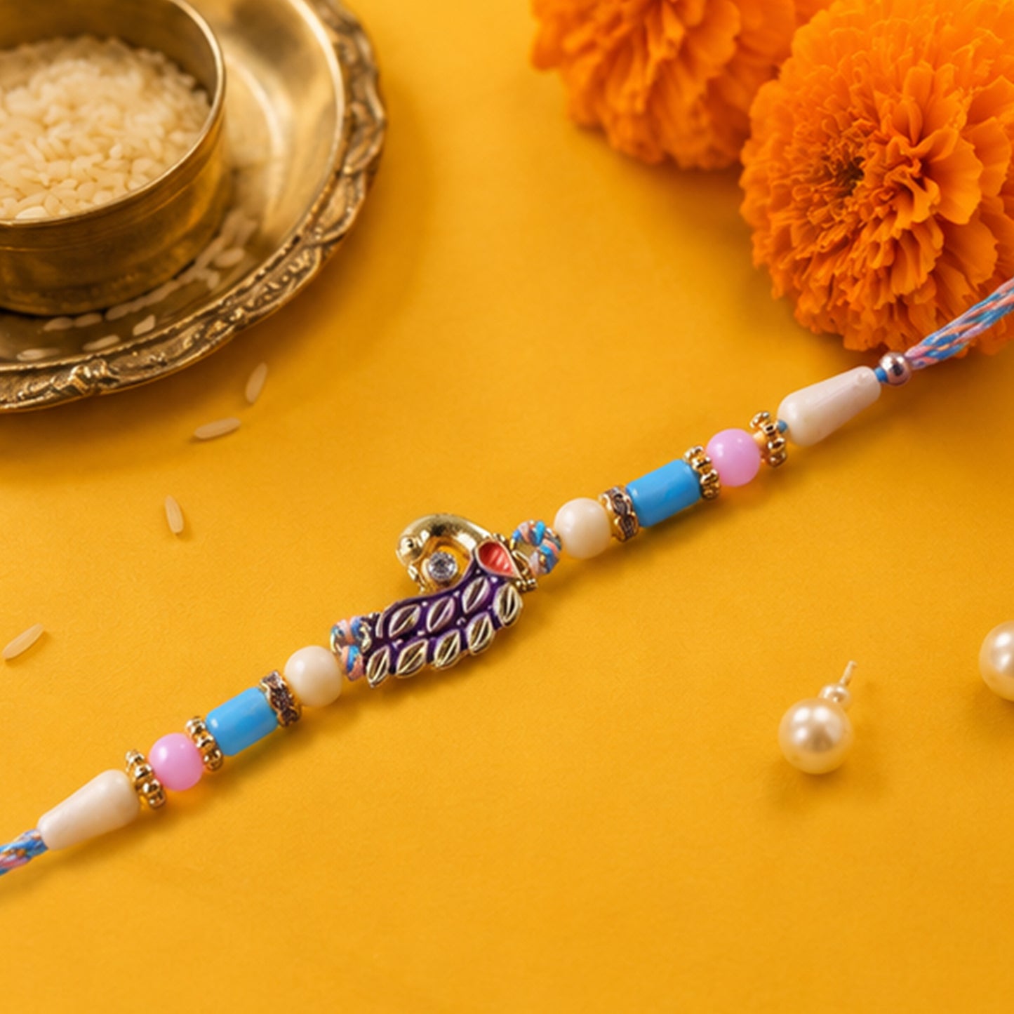 Blue Enamel Peacock Pendant Rakhi with Pastel Beads