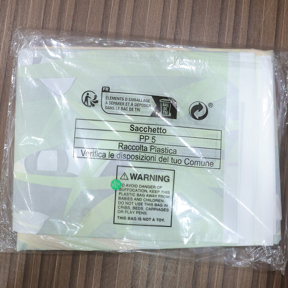 Actual photograph of folded backdrop in plastic packaging