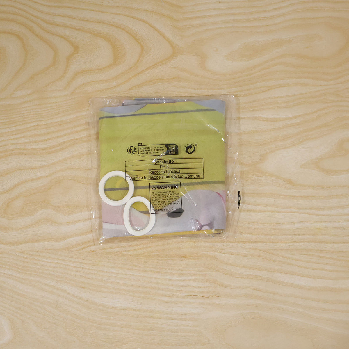 Actual photograph of packaged banner and adhesive rolls