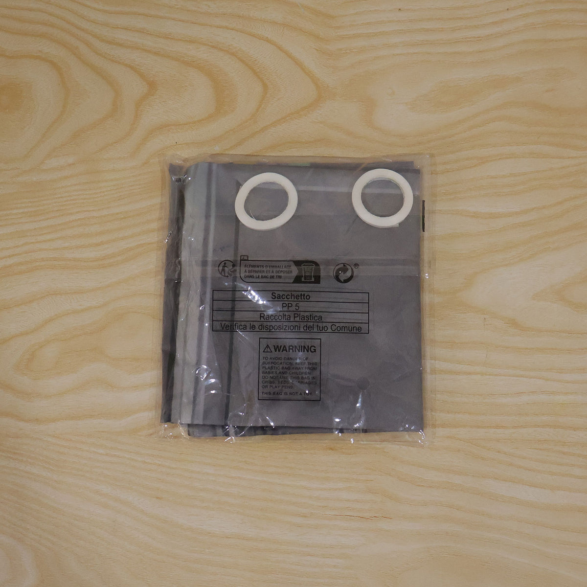 Actual photograph of door banner in plastic packaging