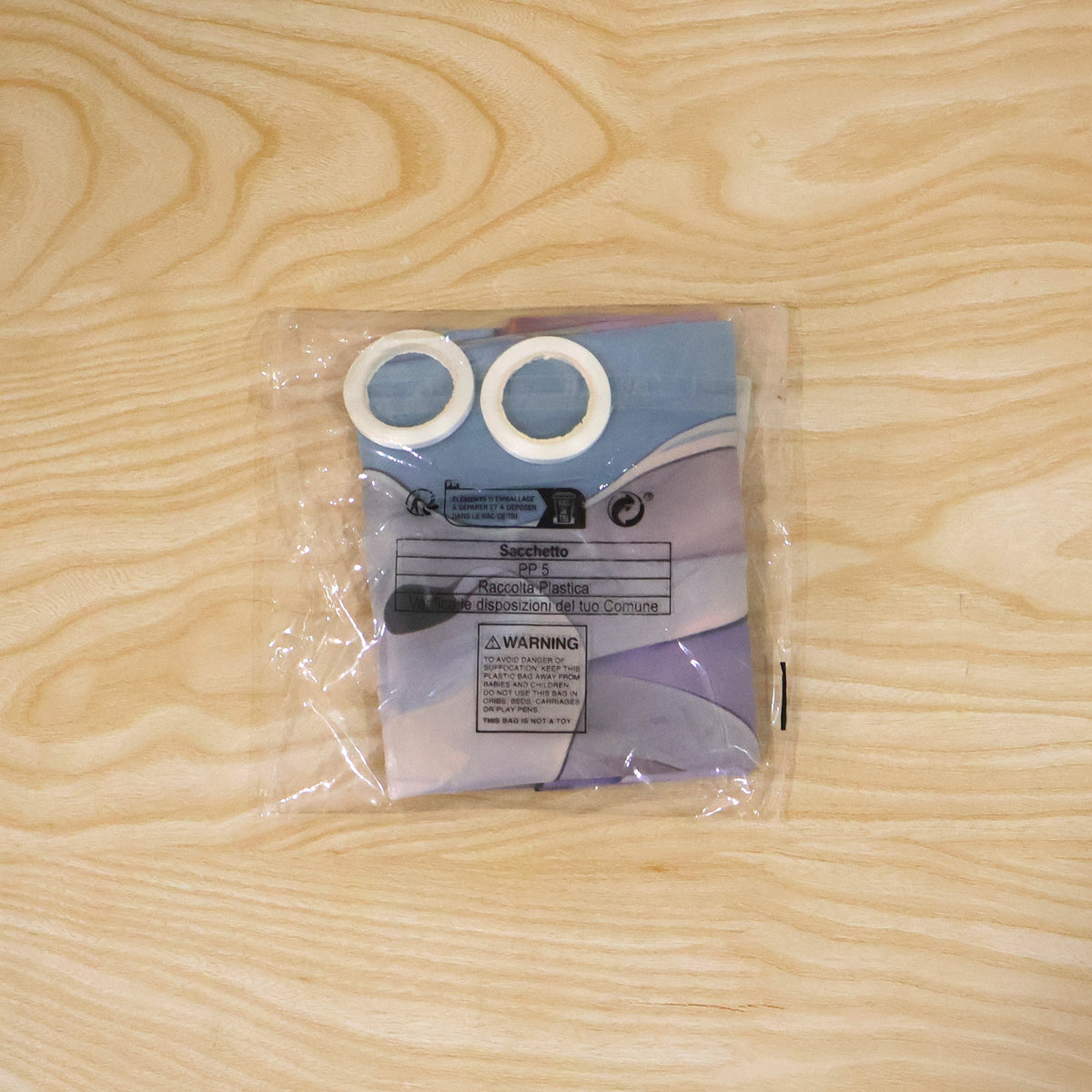 Actual photograph of folded Easter banner in plastic packaging