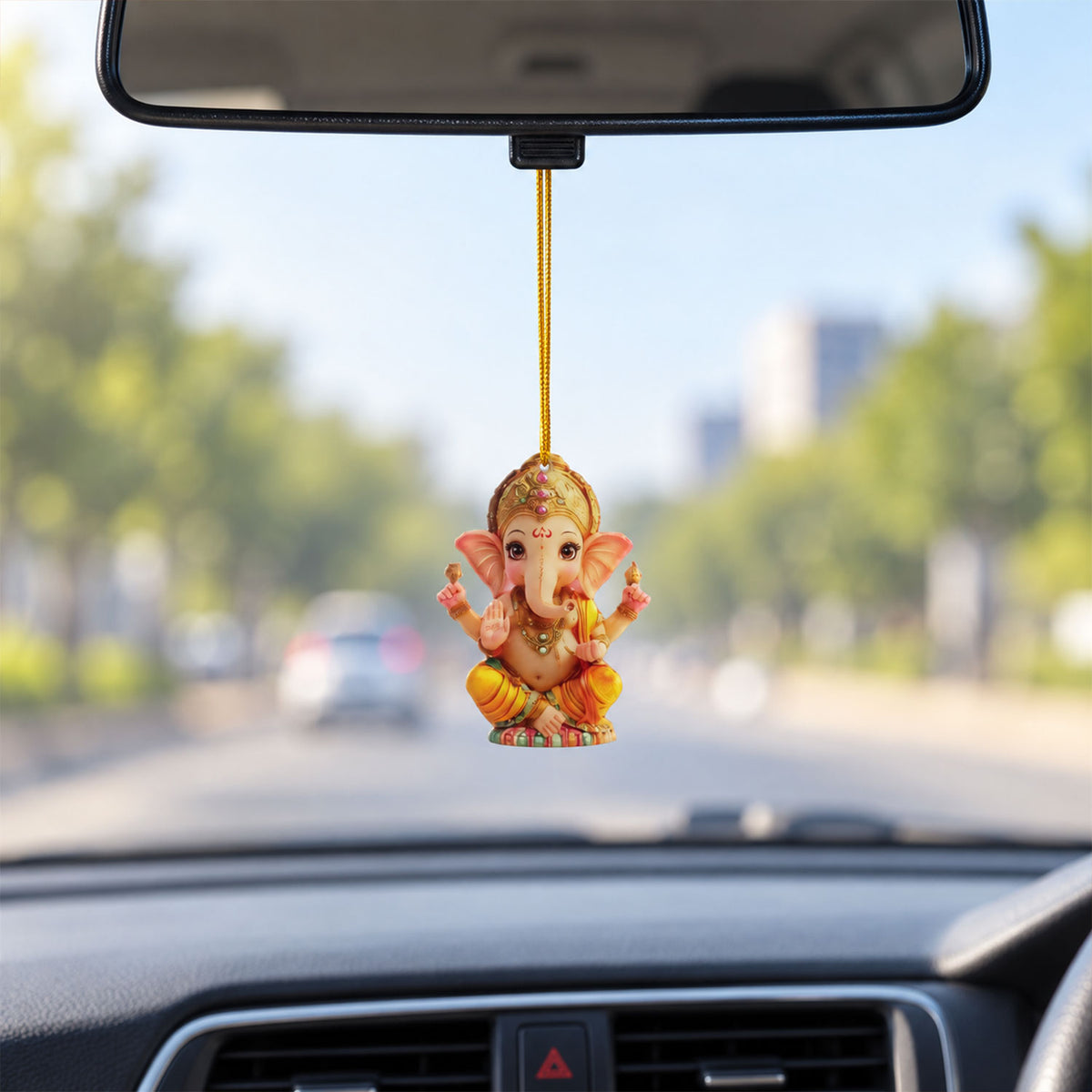 Ganesha ornament shown hanging inside a car