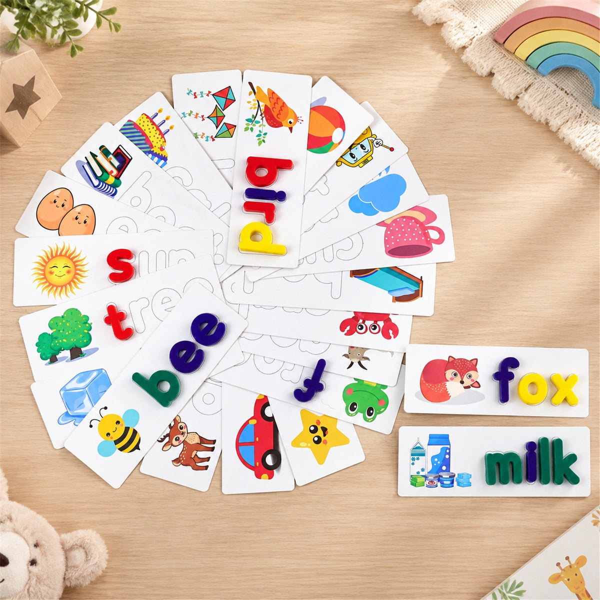 Alphabet word cards and lowercase letter pieces arranged for spelling
